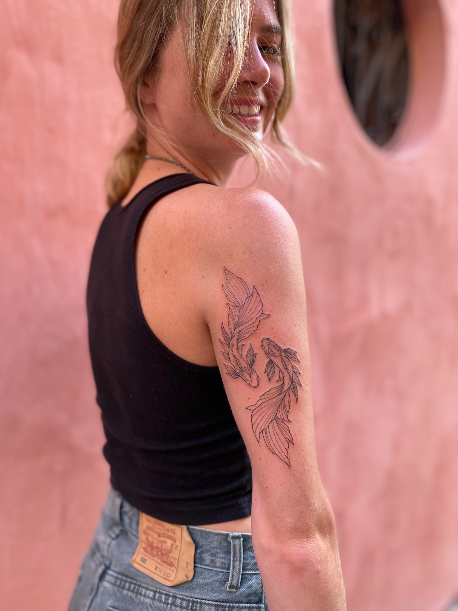 Traveler smiling with a finished tattoo in Cartagena