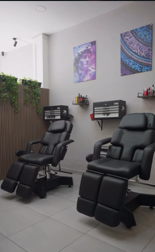 Clean tattoo studio interior with professional chairs